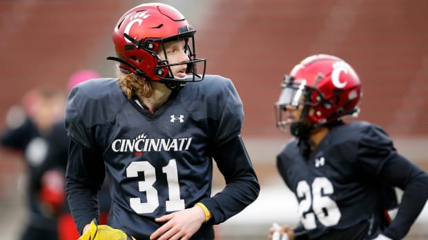 Cincinnati Bearcats punter Mason Fletcher (31) crosses the field between drills during a spring practice at Nippert Stadium in Cincinnati on Thursday, March 24, 2022. Cincinnati Bearcats Spring Practice